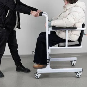 Usage scenario: Caregiver using the Hydraulic Transfer Lift Chair to safely move a patient from a bed to a wheelchair in a home care environment